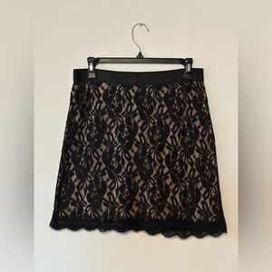 Black and nude lace mini skirt